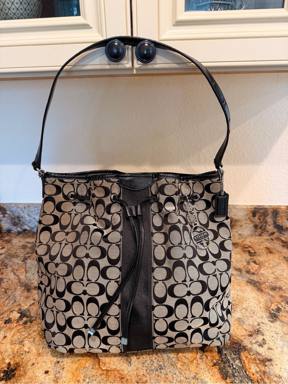 Coach Signature Canvas Drawstring Shoulder Bag in Black/Tan